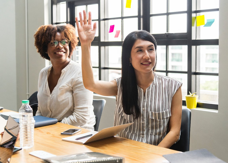 hand raised business meeting